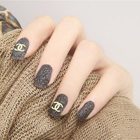 The grey matte manicure with the classic Chanel logo is a low-key and stylish manicure, a classic color scheme.